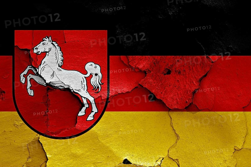 Flags of Lower Saxony and Germany painted on cracked wall