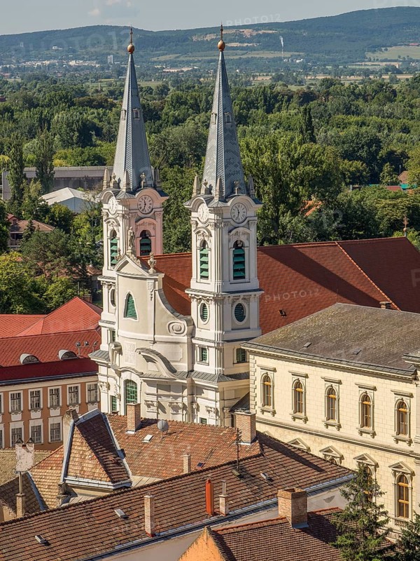 View of church towers and surrounding houses with tiled roofs in a picturesque village, esztergom, danube, hungary