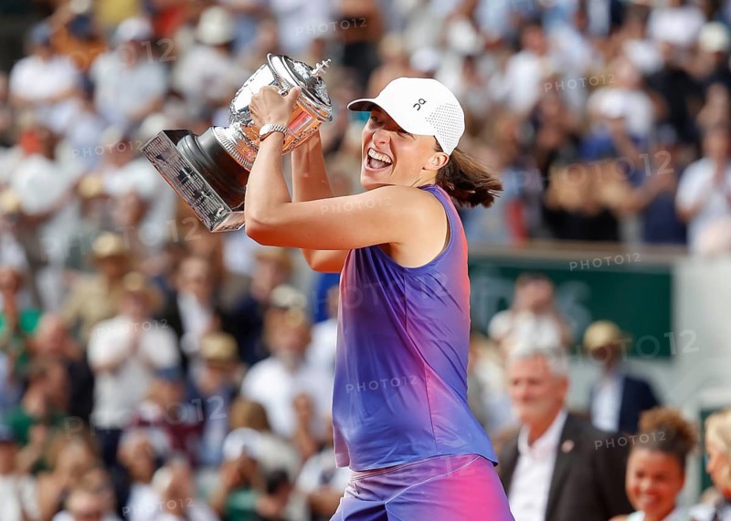French Open 2024 Champion Iga Swiatek of Poland is holding the trophy at Roland Garros, Paris, France.