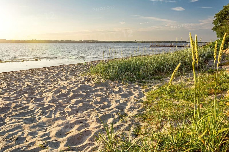 Sunset on a quiet beach in Glücksburg on the Flensburg Fjord in northern Germany
