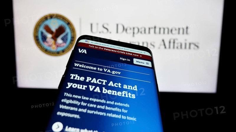 Stuttgart, Germany, 10-30-2023: Smartphone with website of United States Department of Veterans Affairs (VA) in front of seal. Focus on top-left of phone display, Europe