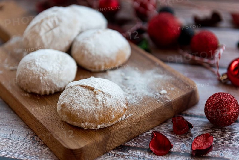 Traditional delicious Greek almond snow balls or Christmas cookies called kourabiedes with almonds and powered with white sugar