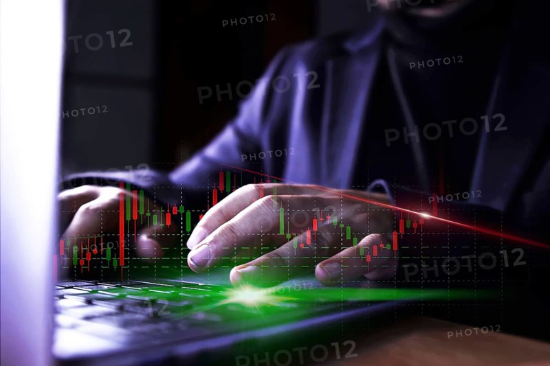 Businessman using computer with stock market virtual increasing stock market graph chart. Business investment profit and deposit dividend saving growth in 2024 concept.
