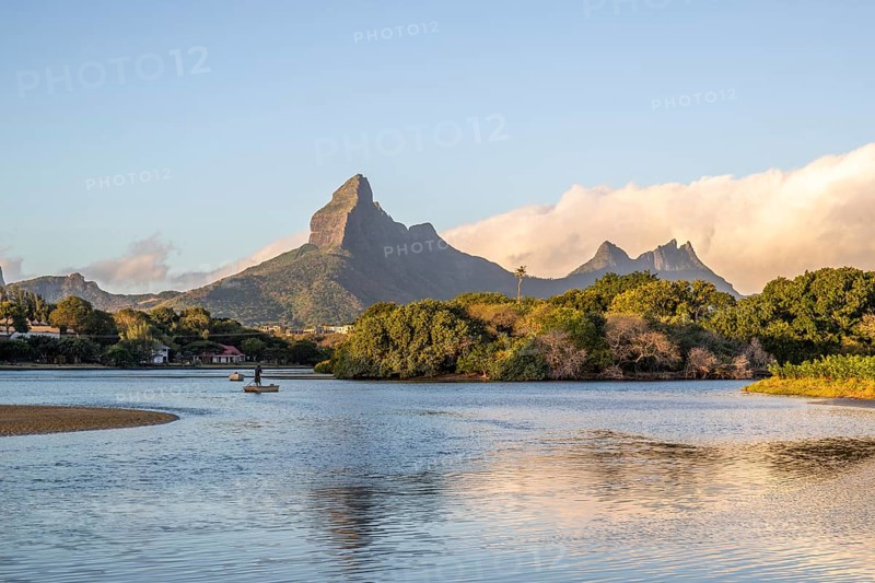 A bay on a river. Dream beach in a pastel-coloured sunset on a holiday island. A gently sloping beach on the island of Mauritius, Tamarin