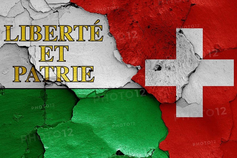 Flags of Vaud canton and Switzerland painted on cracked wall
