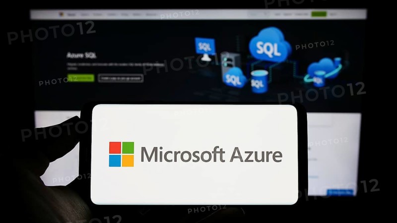 Stuttgart, Germany, 07-11-2023: Person holding cellphone with logo of cloud computing platform Microsoft Azure on screen in front of business webpage. Focus on phone display, Europe