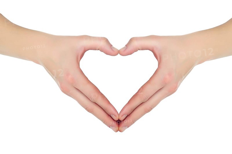 Female hands in the form of heart isolated on white background