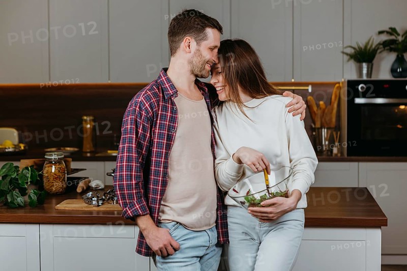 Front view loving couple preparing food home