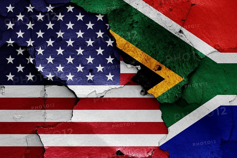 Flags of USA and South Africa painted on cracked wall