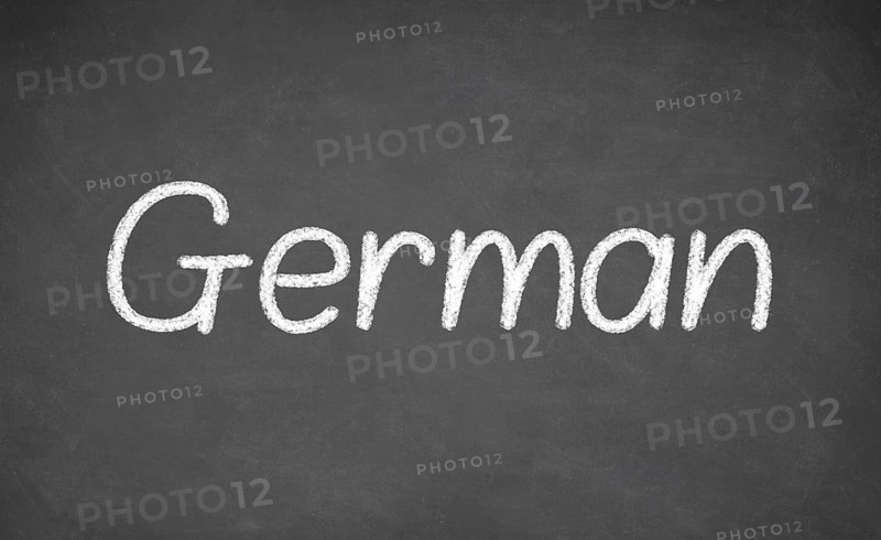 German lesson on blackboard or chalkboard. written in white chalk