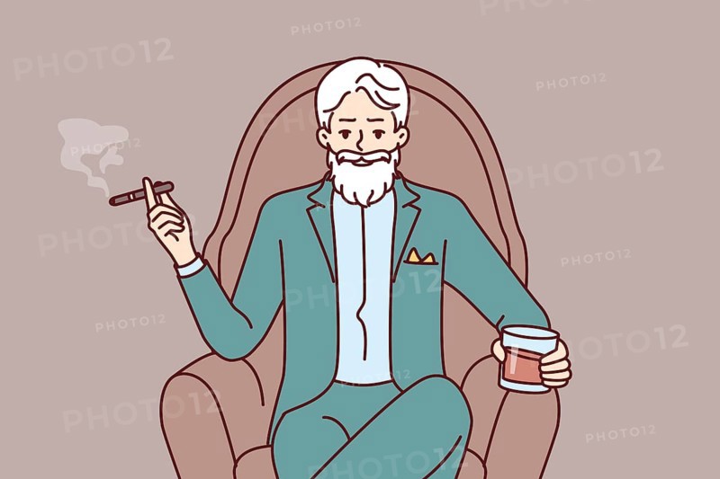 Elderly man aristocrat sits in armchair in expensive formal suit and drinks brandy with cigar. Millionaire aristocrat with gray mustache and beard poses haughtily with glass of alcohol