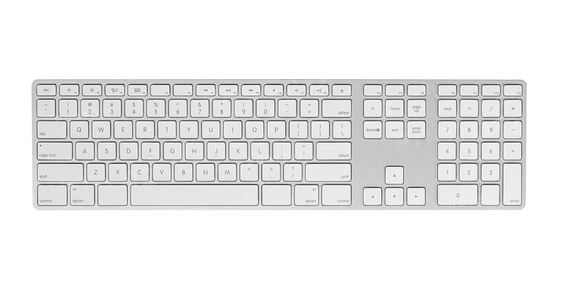 Gray keyboard isolated on white background. Closeup, top view