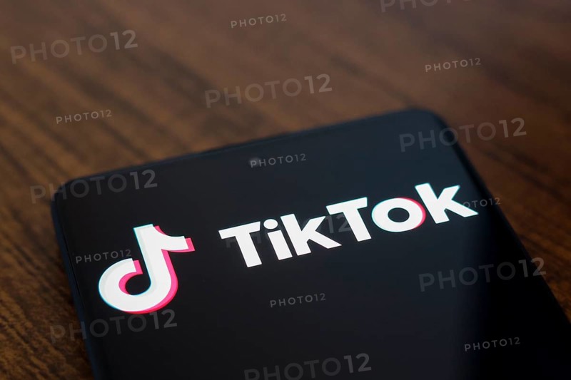 In this photo illustration, the TikTok logo is displayed on a smartphone screen