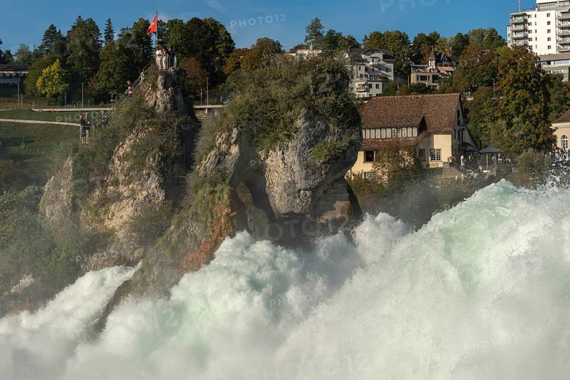 Rhine Falls seen from Laufen Castle, rocky island, Swiss flag, spray, Canton Zurich, on Neuhausen, Switzerland, Europe