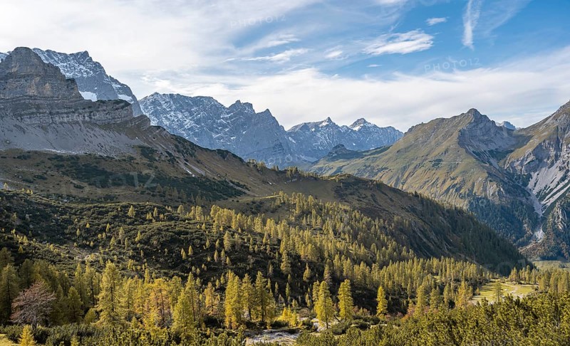 Mountain panorama with steep rocky peaks, yellow-coloured larches in autumn, view of Laliderspitze, Dreizinkenspitze and Spritzkarspitze peaks, hike to the summit of Hahnkampl, Engtal, Karwendel, Tyrol, Austria, Europe