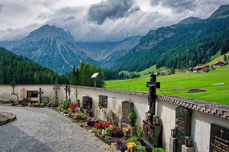 Cemetery of the baroque Roman Catholic parish church of St. Nicholas, cemetery and church under monument protection, Alpine landscape of the Stubai Alps, weather mood, cloudy mood, Obernberg am Brenner, Tyrol, Austria, Europe