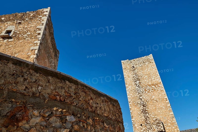 Medieval tower reaching up into a clear blue sky, Flomochori, residential tower village, Mani peninsula, Peloponnese, Greece, Europe