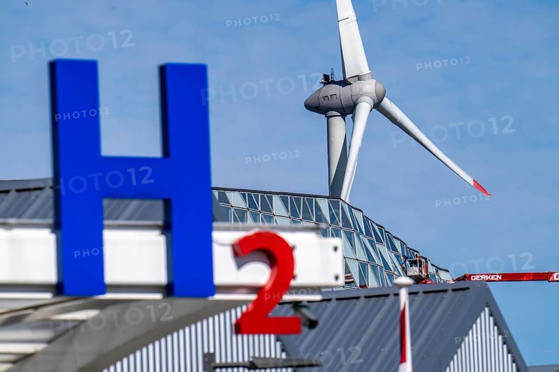 Hydrogen filling station in Antwerp, for cars and lorries, H2 lettering, wind turbine in the harbour, Belgium, Europe