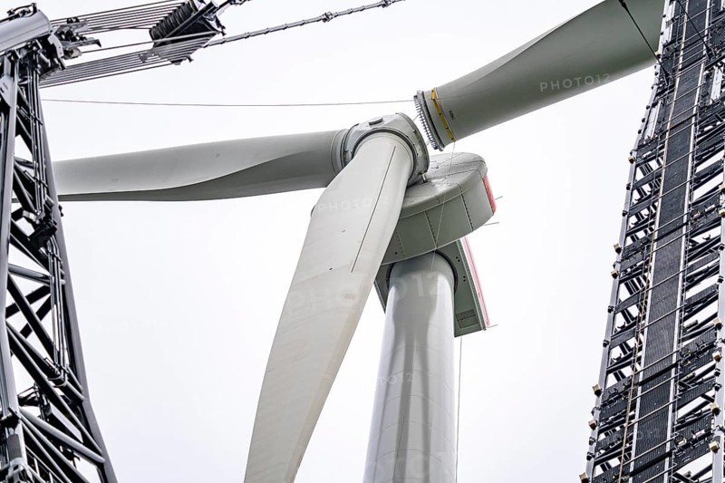 Erection of a wind turbine, wind energy plant, assembly of the third blade, with a crawler lattice crane, wind farm near Hagen, North Rhine-Westphalia, Germany, Europe