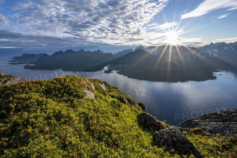 View of Fjord Raftsund and mountains in the evening light, sun star, view from the top of Dronningsvarden or Stortinden, Vesterålen, Norway, Europe