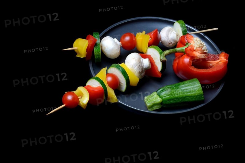 Colourful vegetable skewers on a plate, barbecue skewers