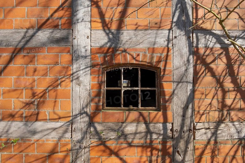 An old rusty window frame of a half-timbered barn, Wildeshauser Geest, Bassum, Diepholz, Lower Saxony, Germany, Europe