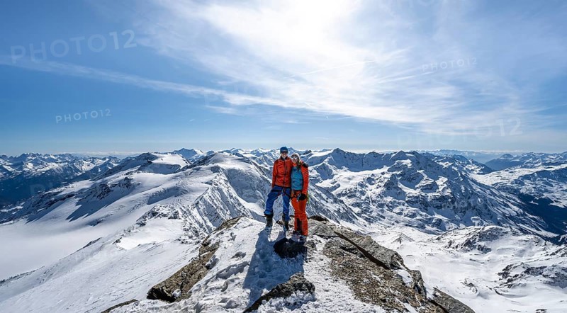 Couple, ski tourers at the summit of Monte Cevedale, mountain panorama, snow-covered mountain landscape in winter, Ortler Alps, Vinschgau Valley, Italy, Europe