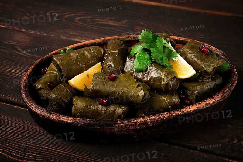 Dolma (Tolma) stuffed rolls, minced meat with rice, in grape leaves, top view, no people, close-up