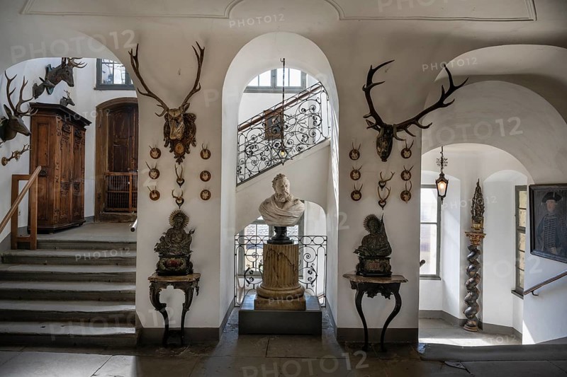 Staircase with hunting trophies and bust of the heraldist Carl Mayer von Mayerfels (1825-1883) in Meersburg Castle, museum, place of interest, Lake Constance, Lake Constance district, Baden-Württemberg, Germany, Europe