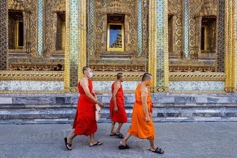 Wat Phra Kaeo temple, royal palace. Royal chapel with Buddhist monks and novices. Bangkok, Thailand, Asia