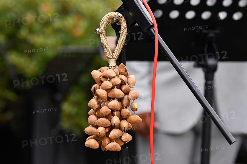 Kenari shaker, a percussion music instrument made from Kenari seed nutshells attached to a wrist strap
