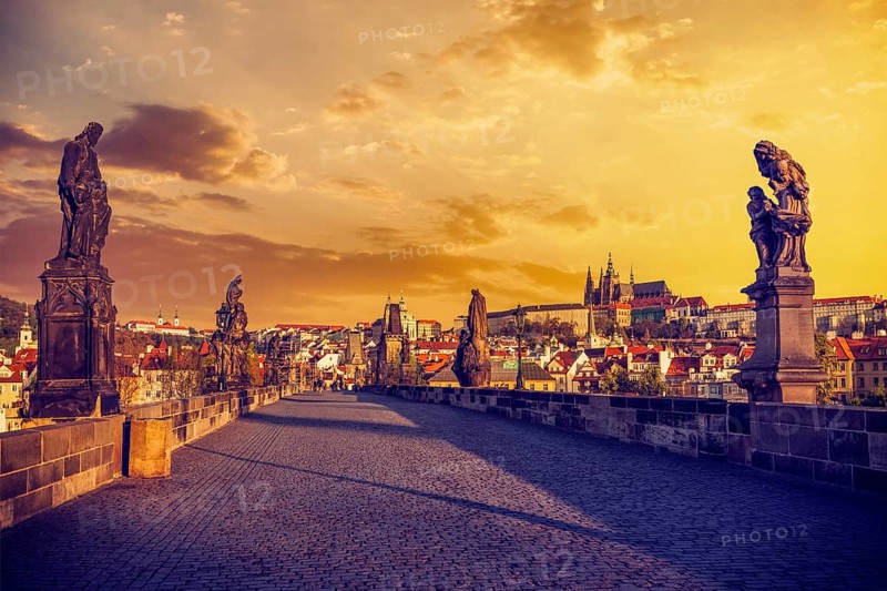 Charles bridge with statues and Prague castle in the early morning on sunrise. Prague, Czech Republic, Europe