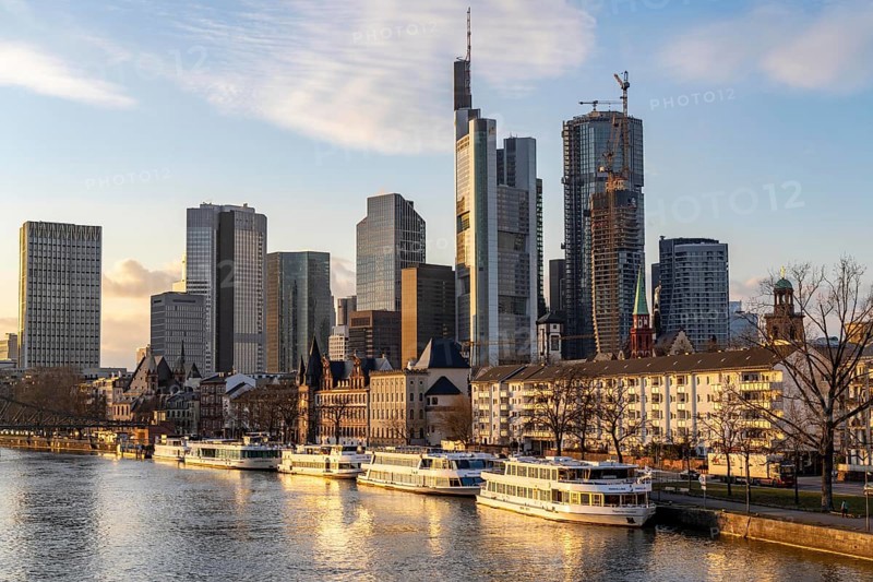 Skyline of the city centre of Frankfurt am Main, river Main, excursion boats at the Mainkai, dusk, Hesse, Germany, Europe