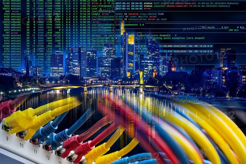 Symbolic image of critical infrastructure, skyline of Frankfurt am Main, data cable, hacker code