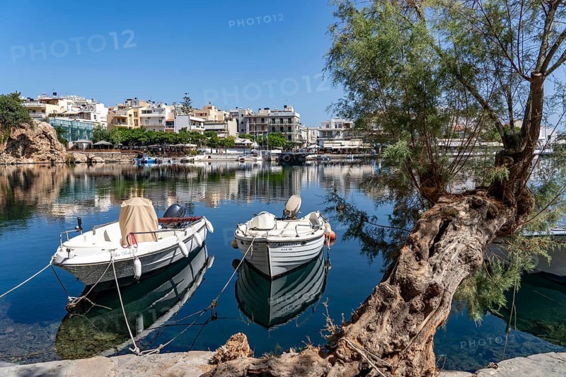 The village of Agios Nikolaos, in the eastern part of Crete, view over Lake Voulismeni, connected to the sea, old town, Greece, Europe