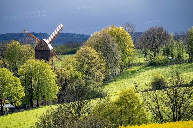 View over Breckerfeld, in the south-east of the Ruhr area, part of the Ennepe-Ruhr district, historic windmill in the Mühlenhof Breckerfeld, a small open-air museum, North Rhine-Westphalia, Germany, Europe