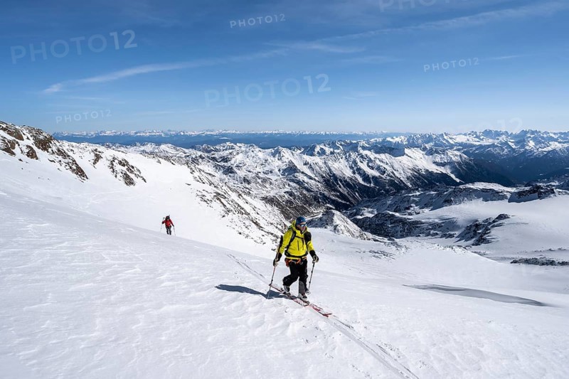 Ski tourers on the glacier, on the ascent to Monte Cevedale, mountain panorama, snow-covered mountain landscape in winter, view into the Martell Valley, high tour, Ortler Alps, Vinschgau Valley, Italy, Europe