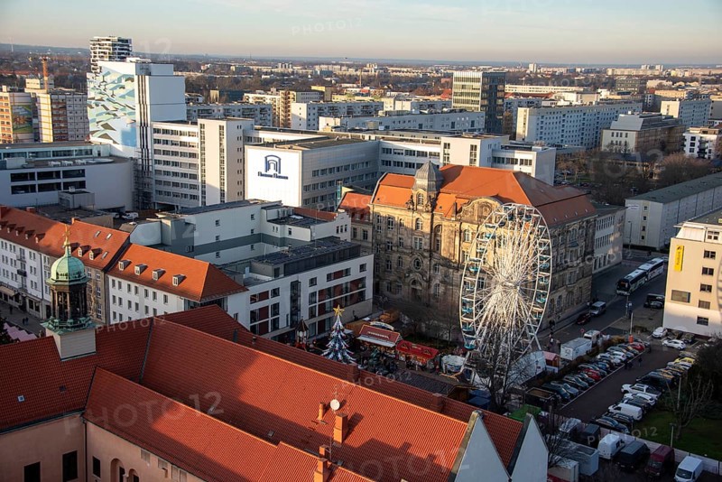 High-rise buildings in the city centre with Ferris wheel at the Christmas market, Magdeburg, Saxony-Anhalt, Germany, Europe