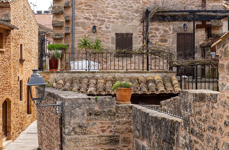 View of Mediterranean houses, roofs and courtyards from the town wall, Alcudia, Majorca, Spain, Europe