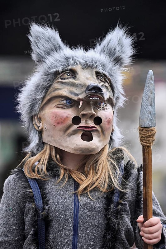Person masked as a wolf at the carnival parade of the Wey guild on Rose Monday, Güdismäntig, Lucerne Carnival 2024, Lucerne, Switzerland, Europe