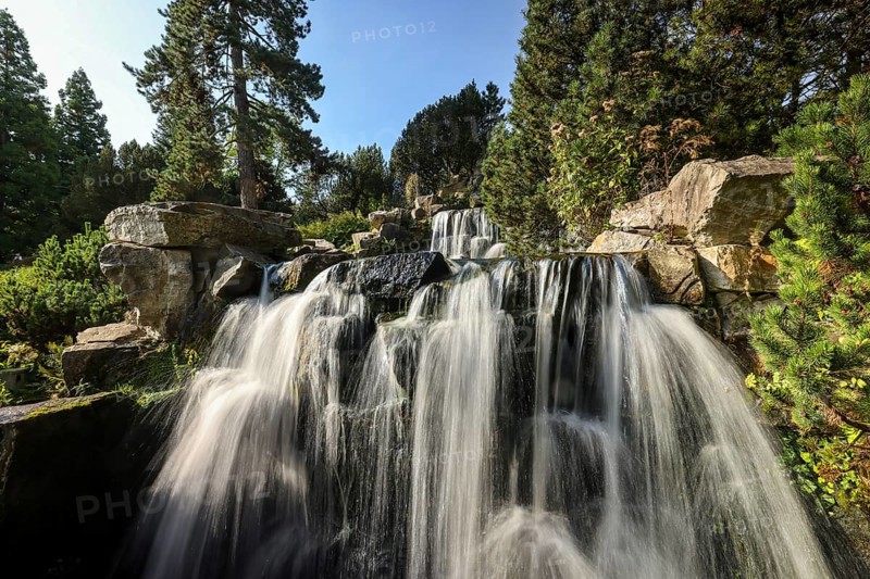 Essen, North Rhine-Westphalia, Germany - Alpinum with waterfall, Grugapark, a park in Essen, emerged from the first Great Ruhrland Horticultural Exhibition in 1929, was the park grounds of the 1965 Federal Garden Show