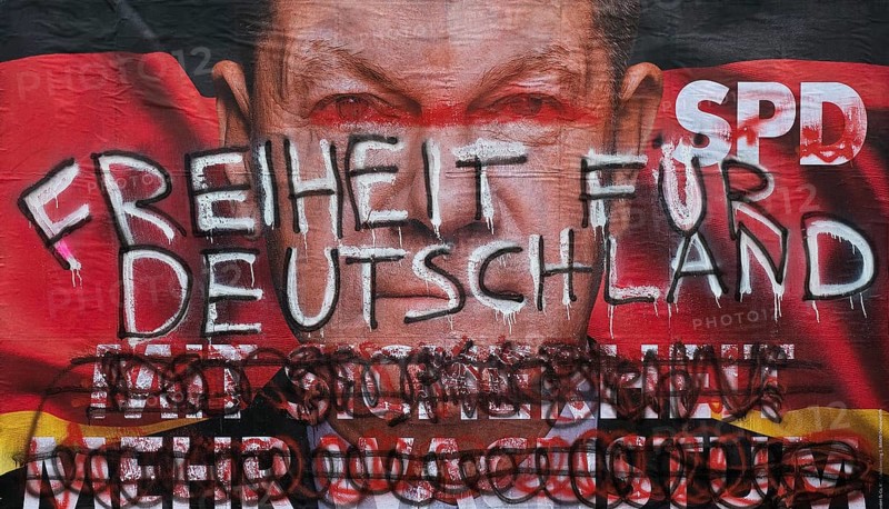 Denigration of a large poster for the 2025 federal election by the SPD with Olaf Scholz, Witten, North Rhine-Westphalia, Germany, Europe