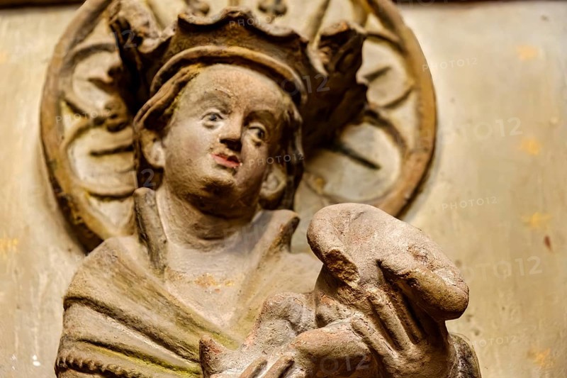 Mother of God with baby Jesus without head, detail of a damaged stone relief of a group of three, Severikirche in Erfurt, Thuringia, Germany, for editorial use only, Europe