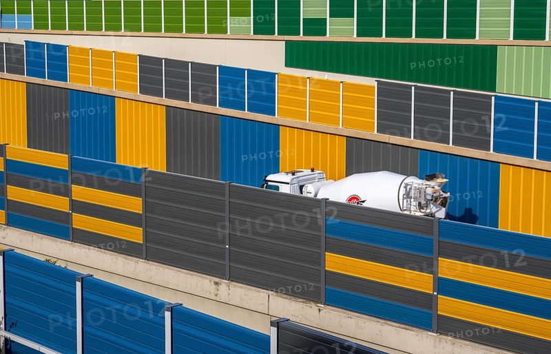 Colourful noise barriers on the A52 motorway, at the Essen-Rüttenscheid junction, the noise barriers were rebuilt in a colourful design as part of the motorway renovation, North Rhine-Westphalia, Germany, Europe