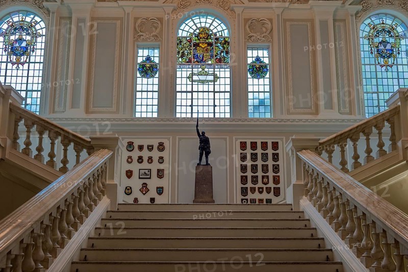 Elegant interior with majestic staircase, statue and stained glass windows, Belfast