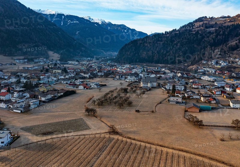 Drone shot, view of village with parish church, Prutz, Kaunertal, Inntal, Tyrol, Austria, Europe