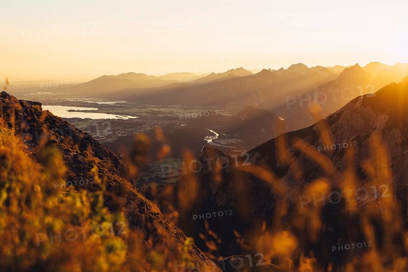 View from the Aggenstein and the foothills of the Alps in Ostallgäu and the Ammergebirge at sunrise, Bavaria, Germany, Europe