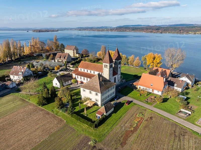 Aerial view of the north-western tip of the island of Reichenau in autumn with the district of Niederzell and the columned basilica of St. Peter and Paul, Lake Constance, district of Constance, Baden-Württemberg, Germany, Europe