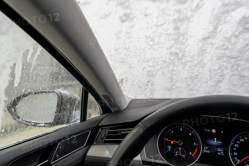 Car in an automatic car wash, car wash tunnel