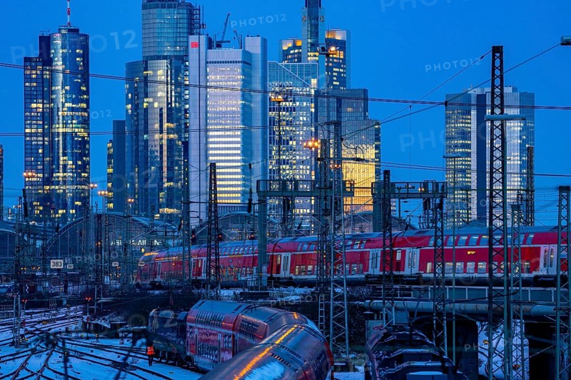 Railway tracks in front of the main railway station in Frankfurt am Main, skyline of skyscrapers in the Cit, winter, snow, dusk, Hesse, North Rhine-Westphalia